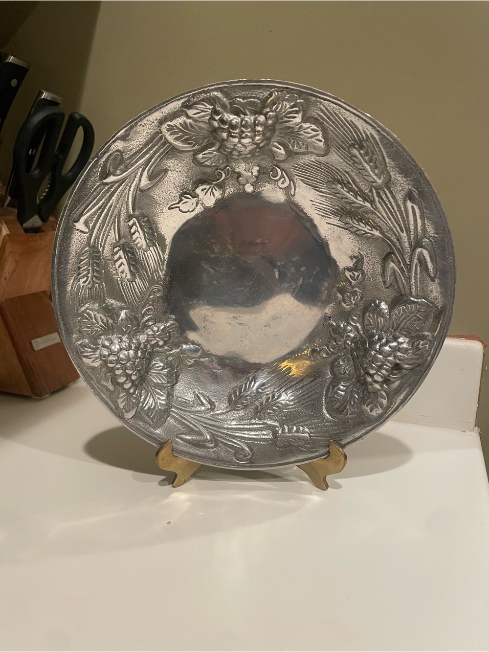Silver bowl with wheat and grapes on edges
